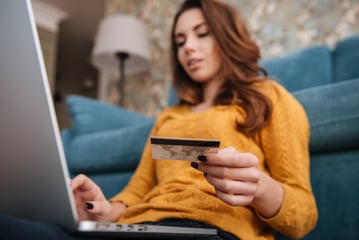 woman paying off credit card on her laptop