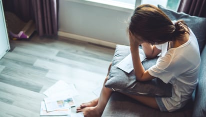 person stressed about money