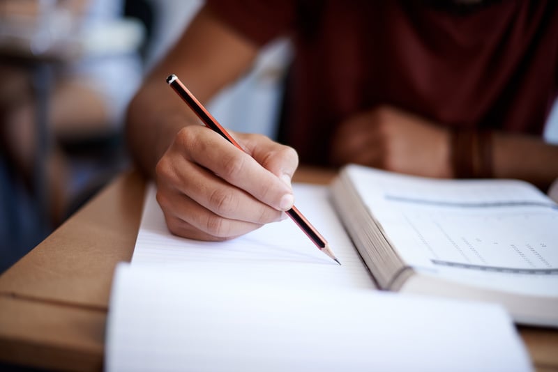 writing-on-notepad_492643646
