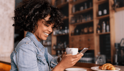 woman checking her credit score on her phone